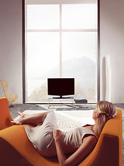 Image showing Blond woman watching TV