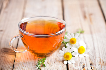 Image showing cup of tea with chamomile flowers 