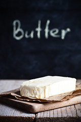 Image showing fresh butter and blackboard