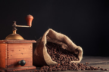 Image showing old grinder and jute bag