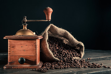 Image showing old grinder and jute bag