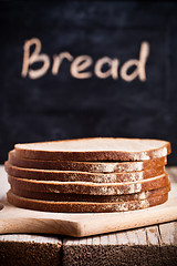 Image showing slices of rye bread and blackboard
