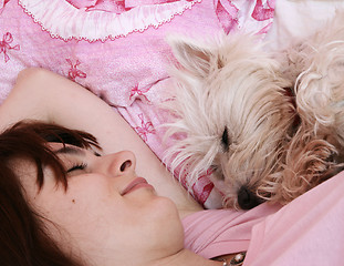 Image showing Dog sleeping on bed 