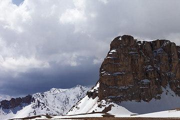 Image showing Snowy rocks and cloudy sky