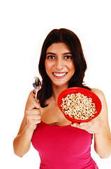 Image showing Woman eating serial.