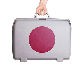 Image showing Used plastic suitcase with stains and scratches