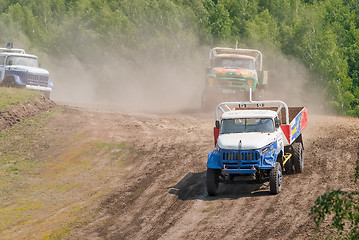 Image showing Trucks racing on unpaved sport track