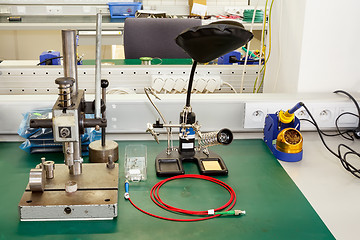 Image showing electronics equipment assembly workplace