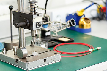 Image showing electronics equipment assembly workplace