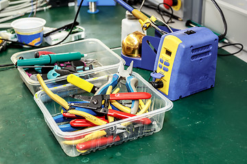 Image showing electronics equipment assembly workplace