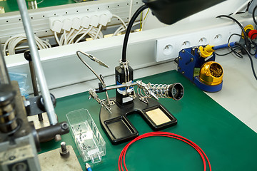 Image showing electronics equipment assembly workplace