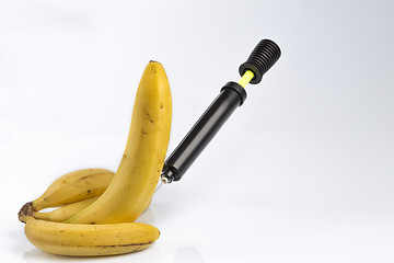 Image showing Bananas and bicycle pump