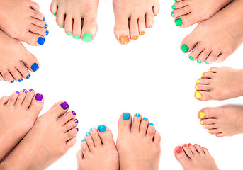 Image showing womens legs and nails isolated on the white background