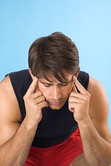 Image showing young man having a headache