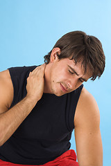 Image showing young man having a headache