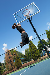 Image showing Basketball Player Dunking