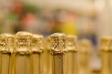 Image showing close up champagne bottle cork wrapped shiny paper 