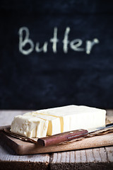 Image showing fresh butter and blackboard 