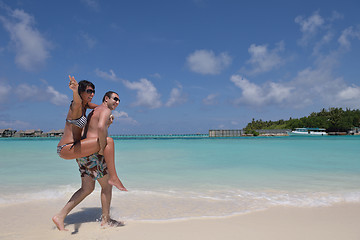 Image showing happy young couple have fun on beach