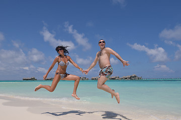 Image showing happy young couple have fun on beach