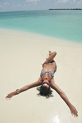 Image showing beautiful young woman  on beach have fun and relax