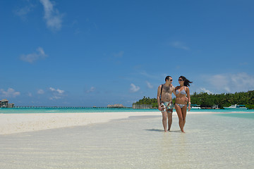 Image showing happy young couple have fun on beach