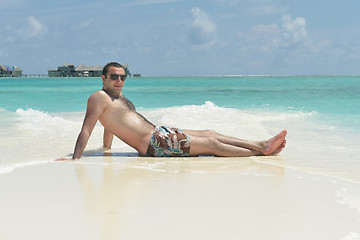 Image showing young man have fun and relax on beach