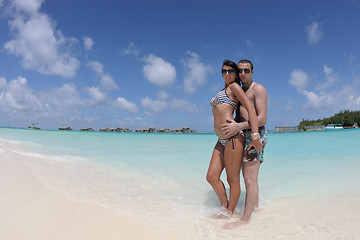 Image showing happy young couple have fun on beach