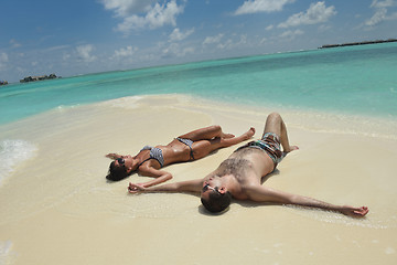 Image showing happy young couple have fun on beach