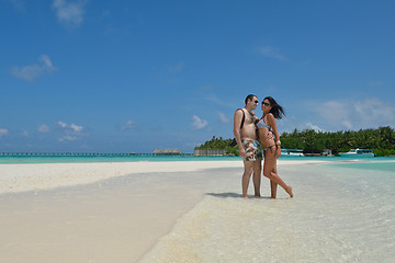 Image showing happy young couple have fun on beach