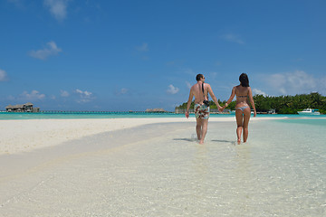 Image showing happy young couple have fun on beach