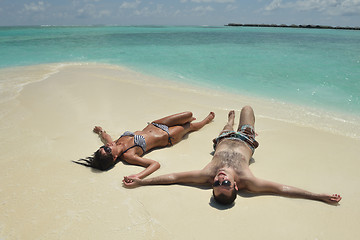 Image showing happy young couple have fun on beach