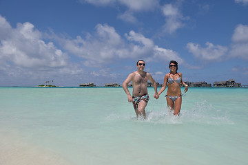 Image showing happy young couple have fun on beach