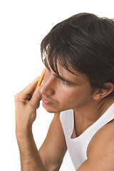 Image showing close up of young man shaving