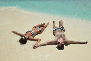 Image showing happy young couple have fun on beach