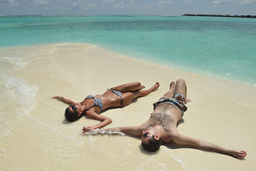 Image showing happy young couple have fun on beach