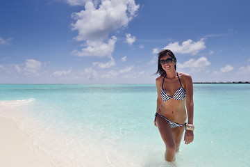 Image showing beautiful young woman  on beach have fun and relax