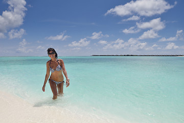 Image showing beautiful young woman  on beach have fun and relax