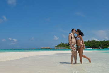 Image showing happy young couple have fun on beach