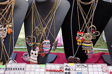 Image showing stand with owl shape pendant necklace decorations