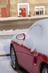 Image showing close up of car side covered with snow in parking 