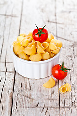 Image showing uncooked pasta and cherry tomatoes in a bowl 