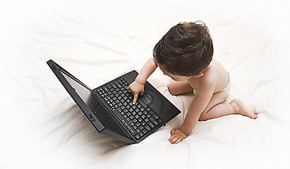 Image showing baby and laptop