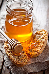 Image showing crackers and honey