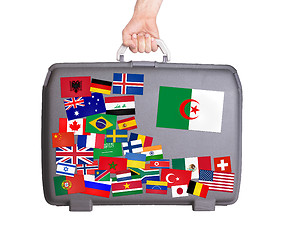 Image showing Used plastic suitcase with stickers