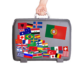 Image showing Used plastic suitcase with stickers