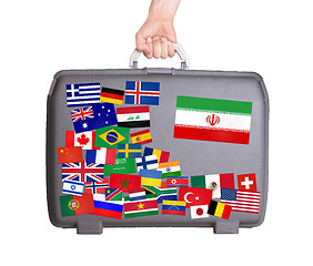 Image showing Used plastic suitcase with stickers