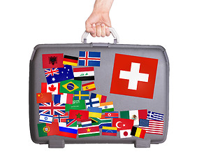 Image showing Used plastic suitcase with stickers