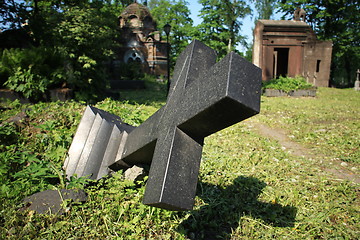 Image showing felled grave cross