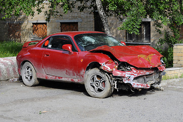 Image showing The red broken car after accident.